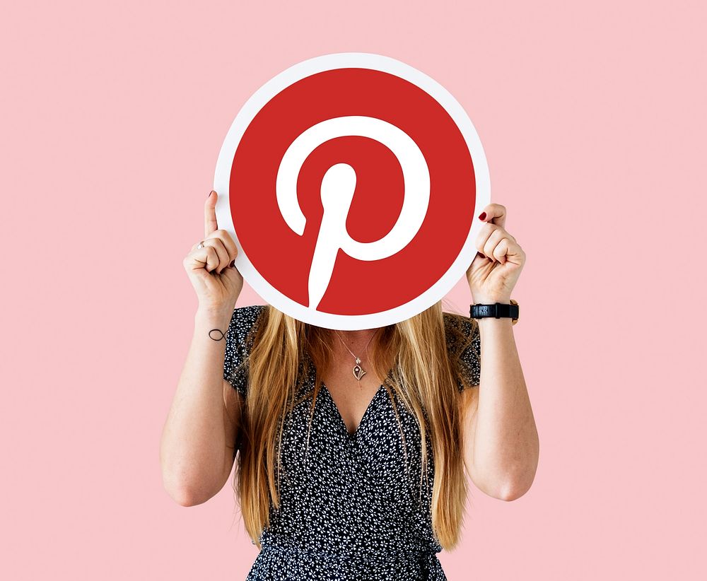 Woman showing a Pinterest icon