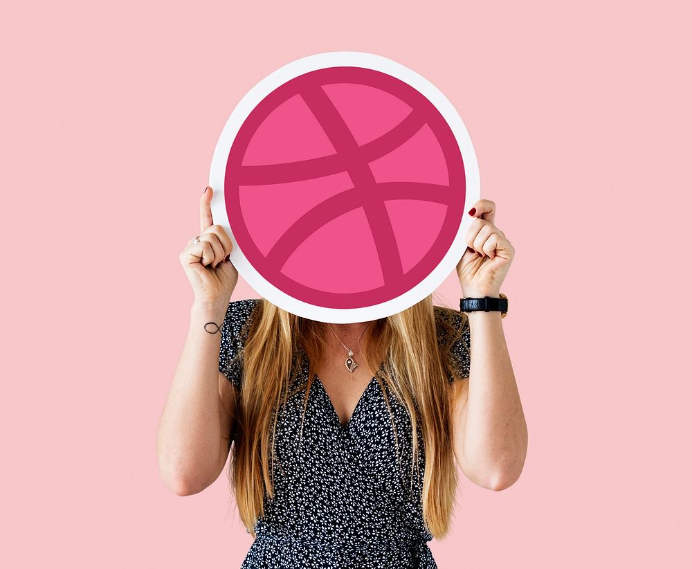 Woman holding a Dribbble icon