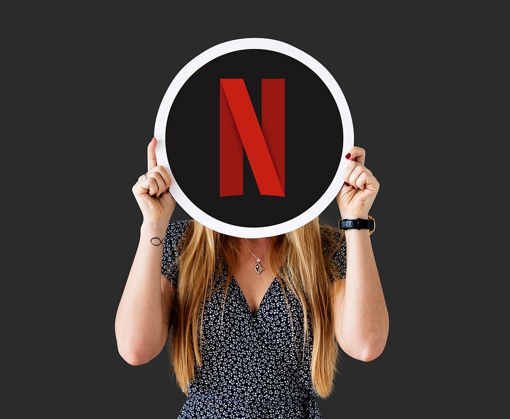 Woman showing a Netflix icon