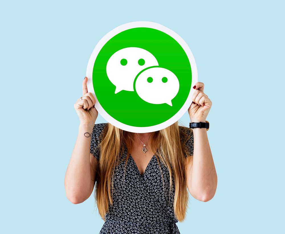 Woman showing a WeChat icon