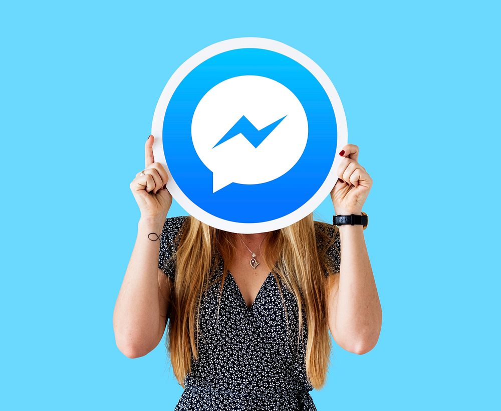 Woman showing a Facebook Messenger icon