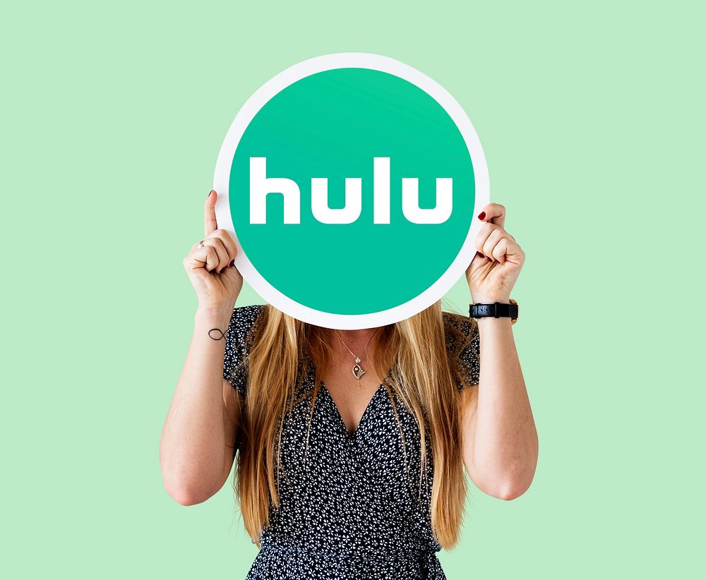 Woman showing a Hulu sign