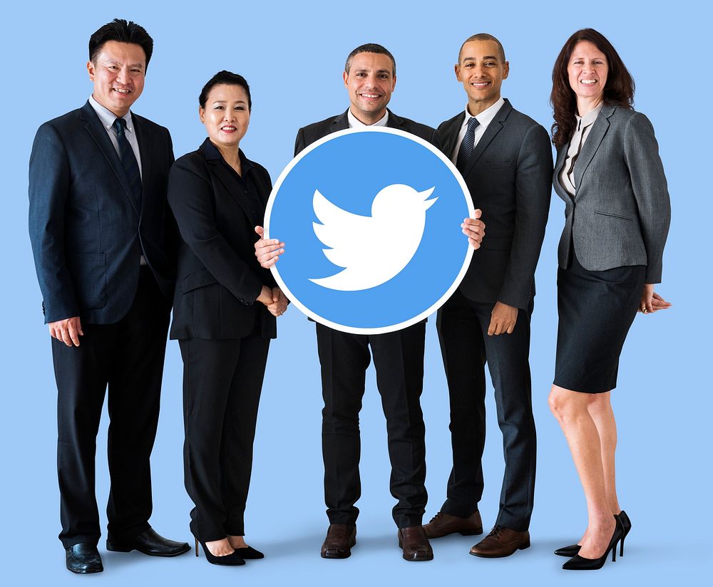 Business people showing a Twitter icon