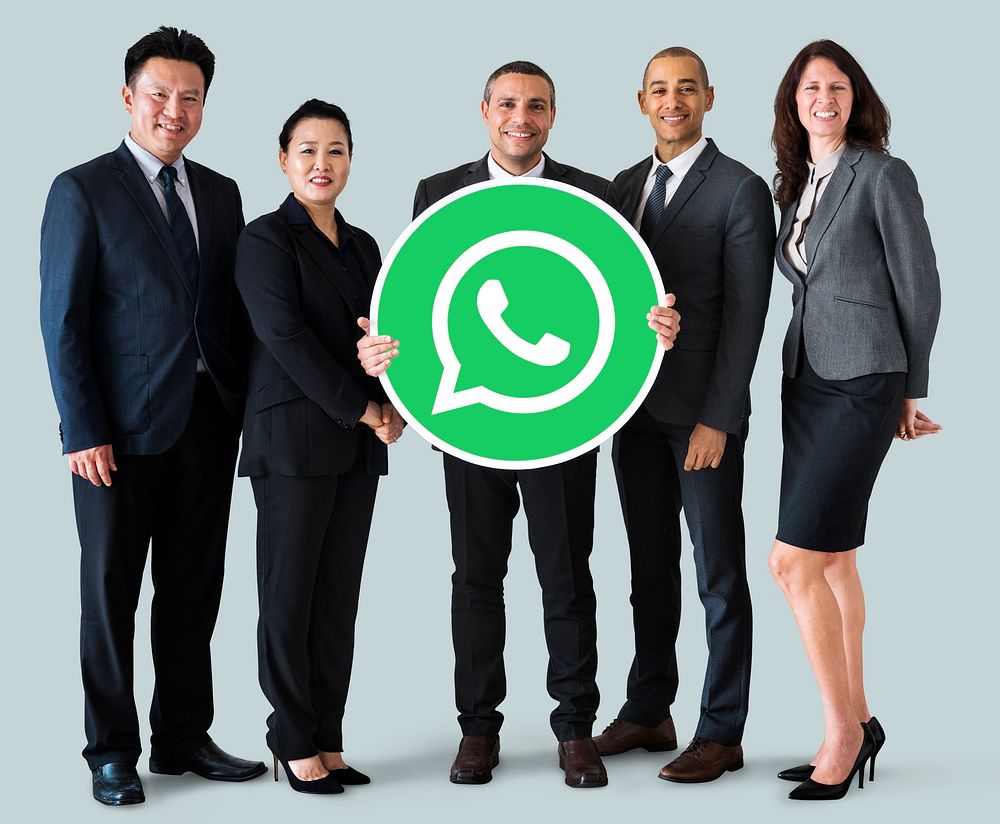 Business people showing a WhatsApp Messenger icon