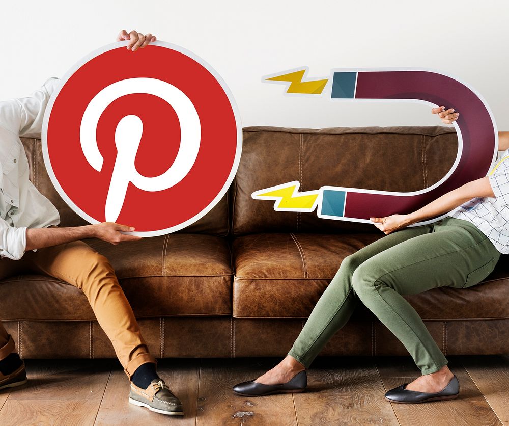 People holding a Pinterest icon