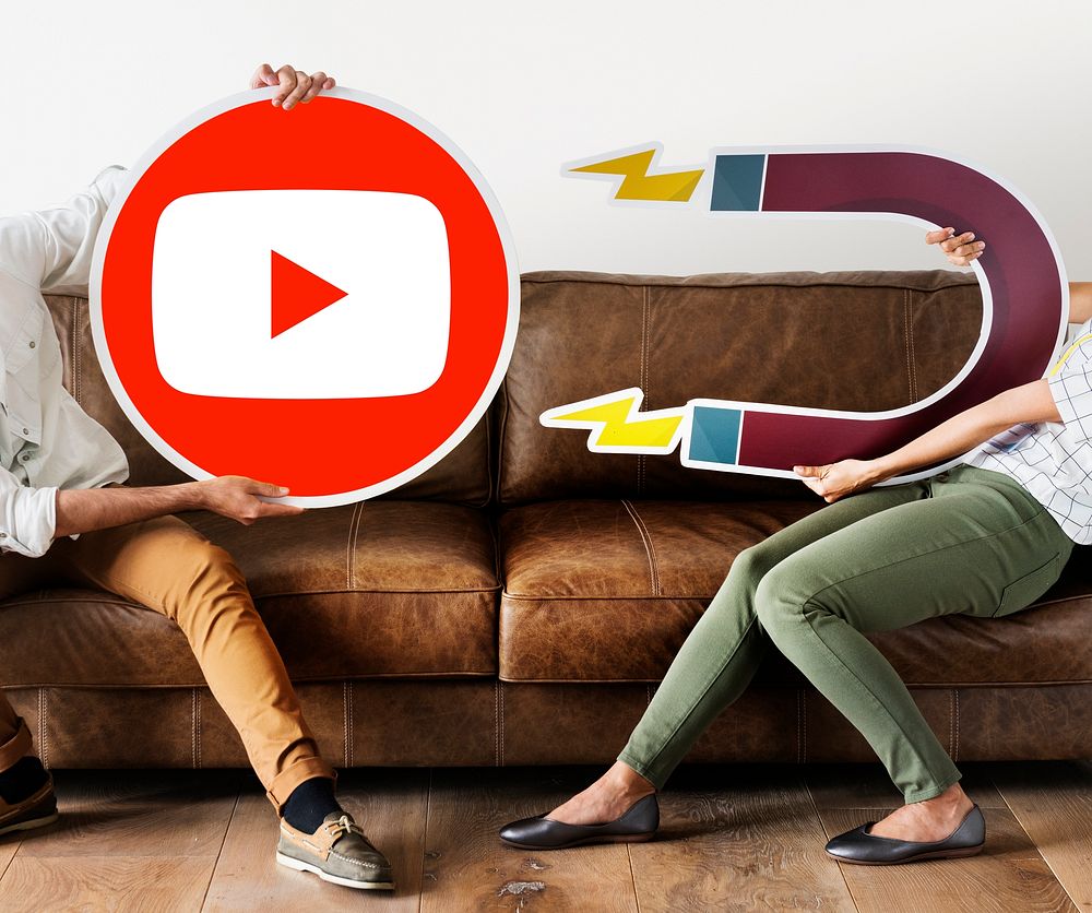 People holding a YouTube icon