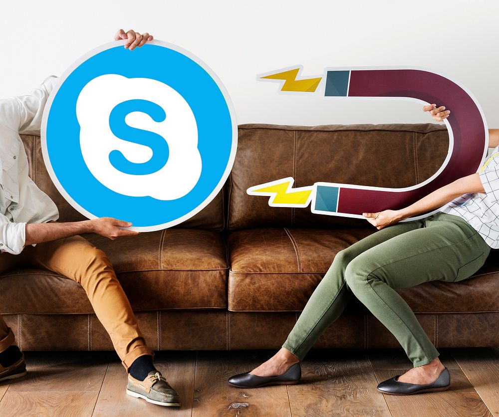 People holding a Skype icon