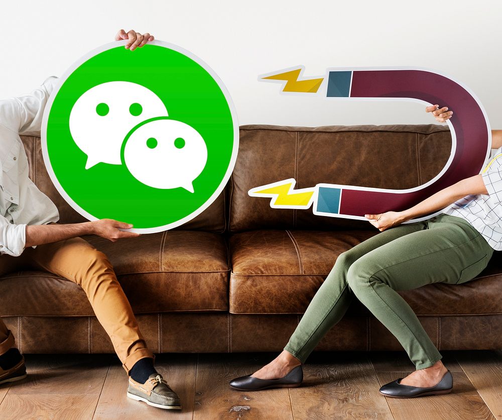 People holding a WeChat icon