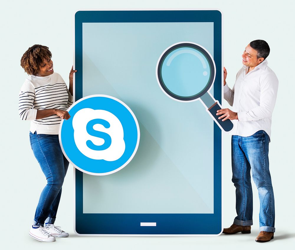 Couple searching for Skype on a phone