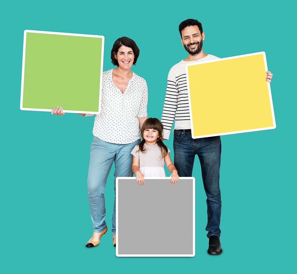 Happy family holding empty square shaped boards