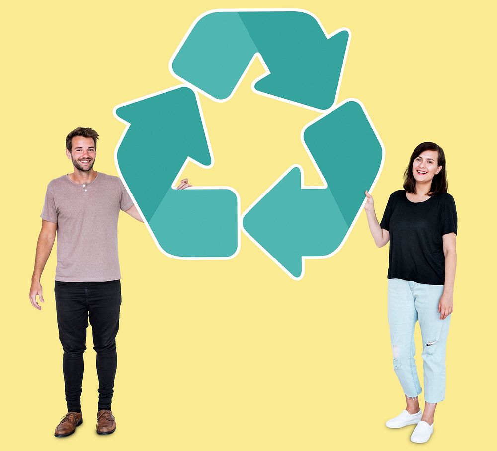 People holding a green recycling symbol