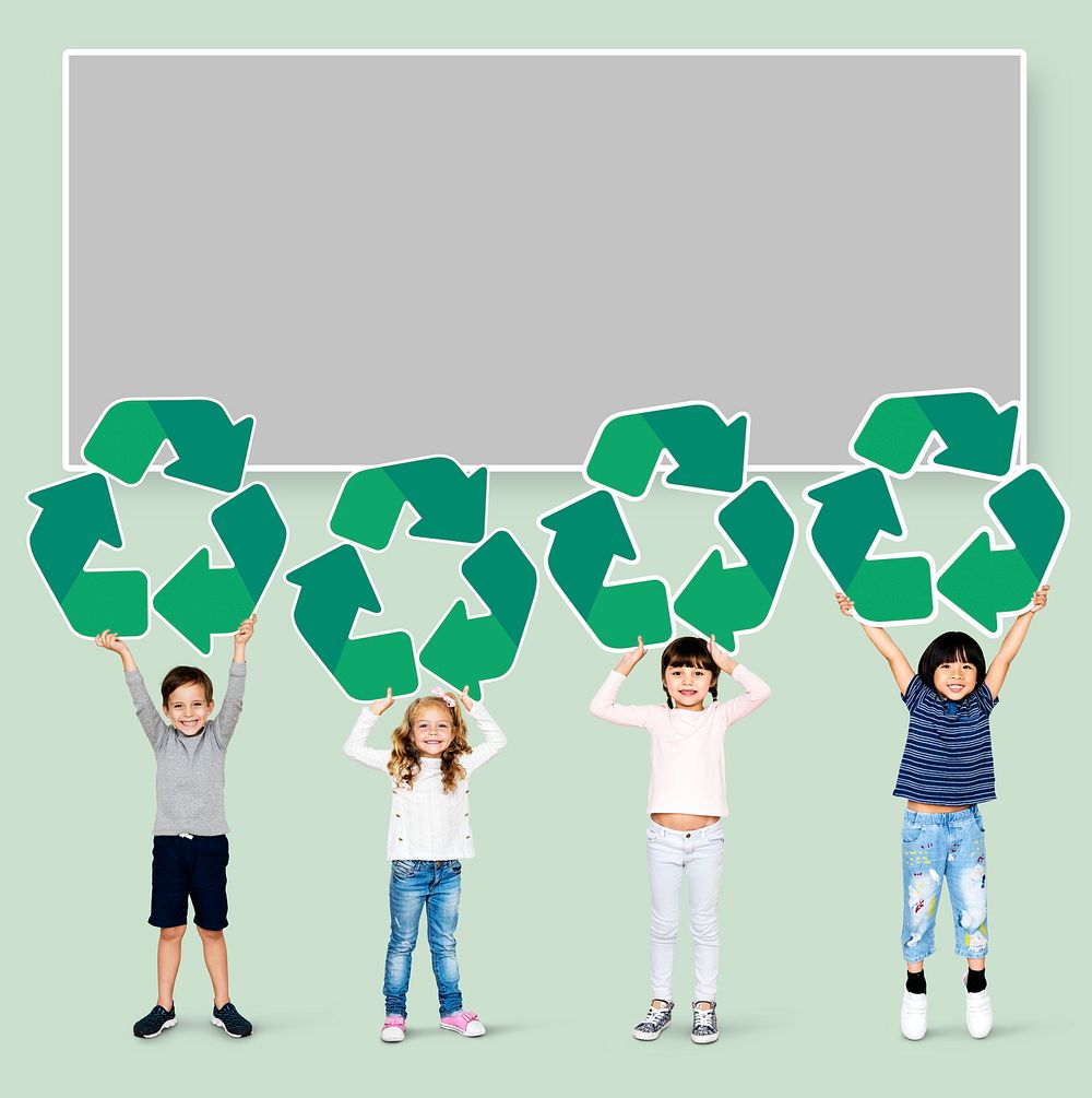 Happy kids holding recycle icons