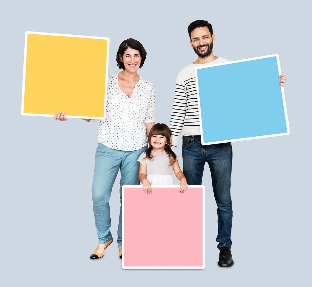 Happy family holding square shaped boards