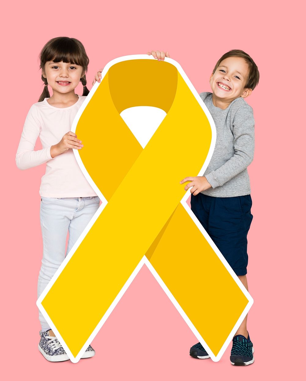 Kids holding a golden ribbon supporting childhood cancer awareness