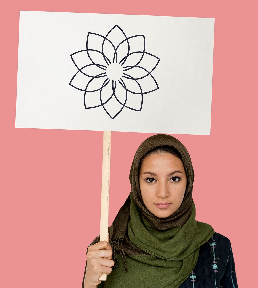 Muslim girl holding a sign