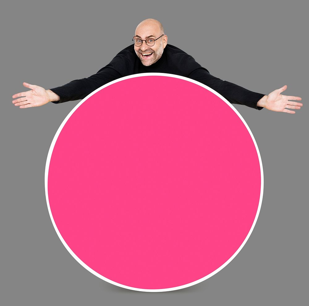 Man showing a blank pink circle