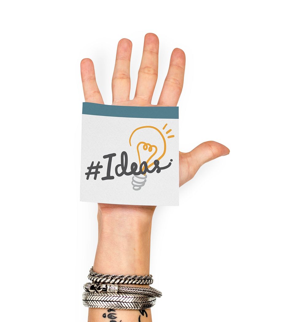 Hand showing a sticky note with Ideas