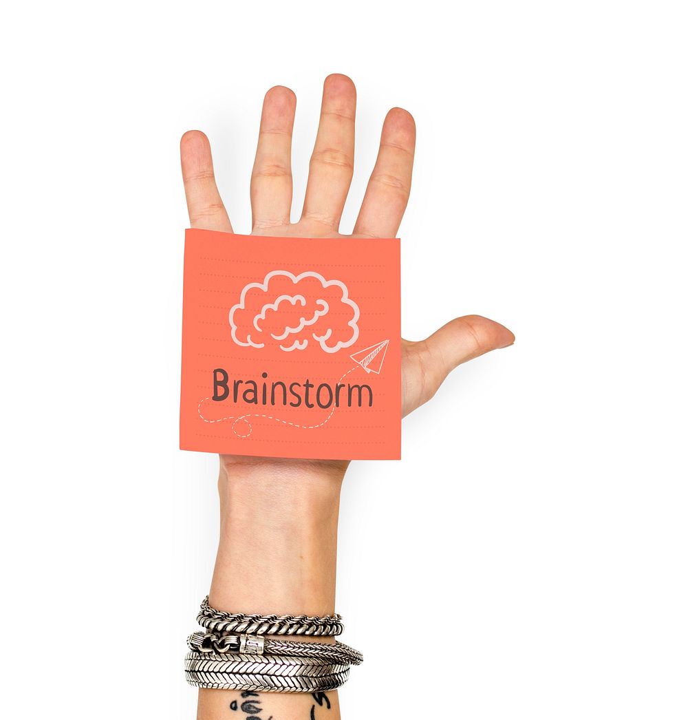 Hand showing a sticky note with Brainstorm
