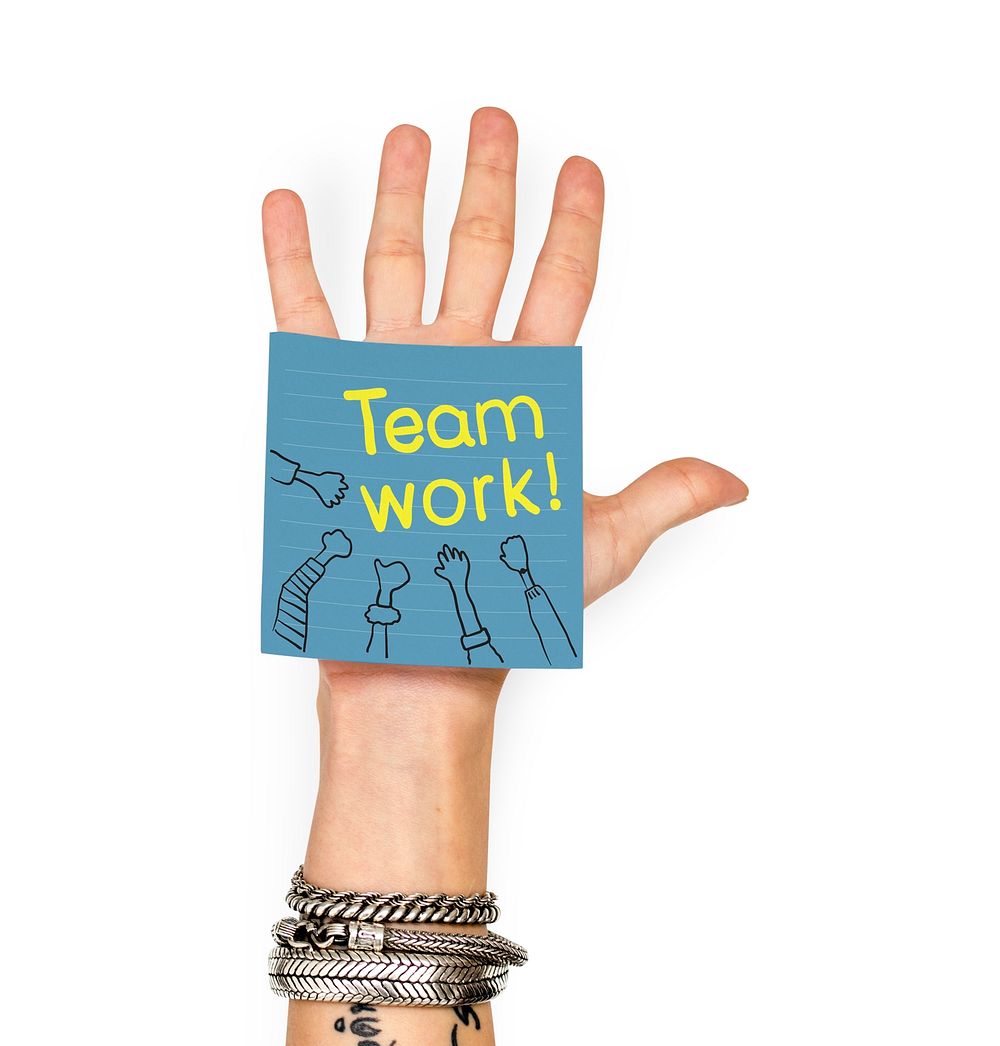 Hand showing a sticky note with Teamwork