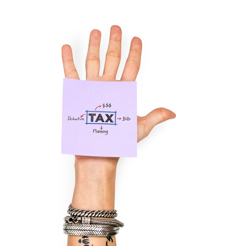 Sticky note with tax plan stuck on a hand
