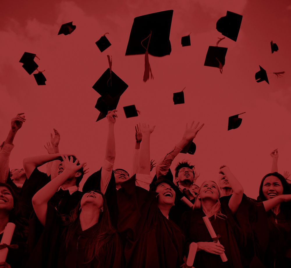 Graduating students throwing hats in the air