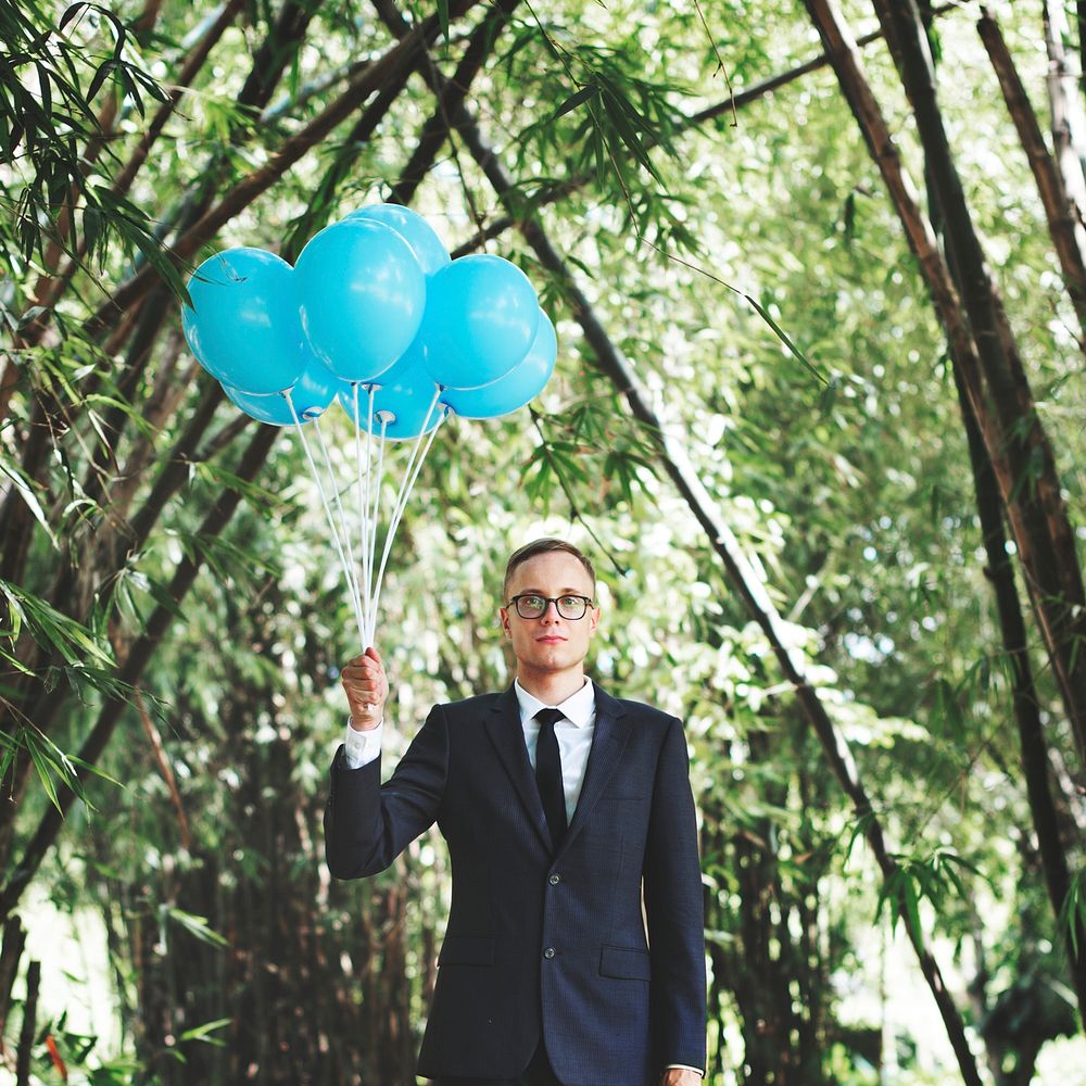 Businessman Holding Balloons Nature Concept