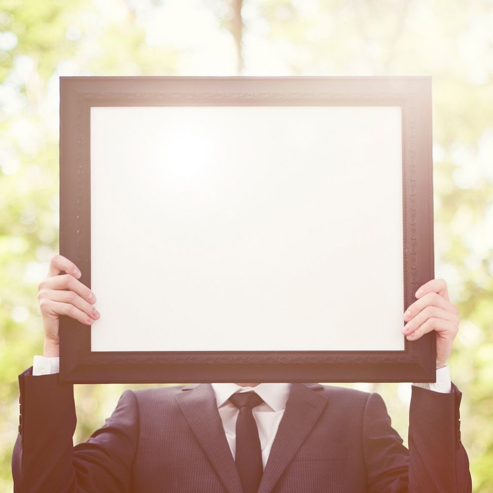 Businessman Holding Picture Frame Copy Space Concept