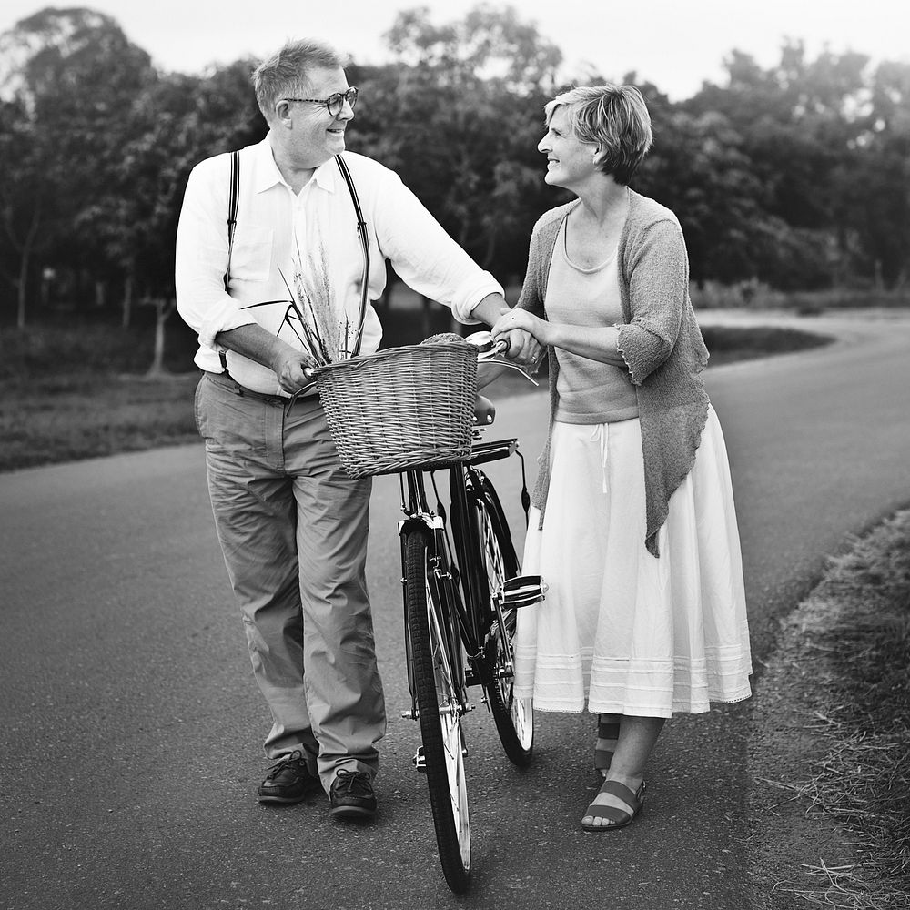 Lovely mature couple with a bicycle