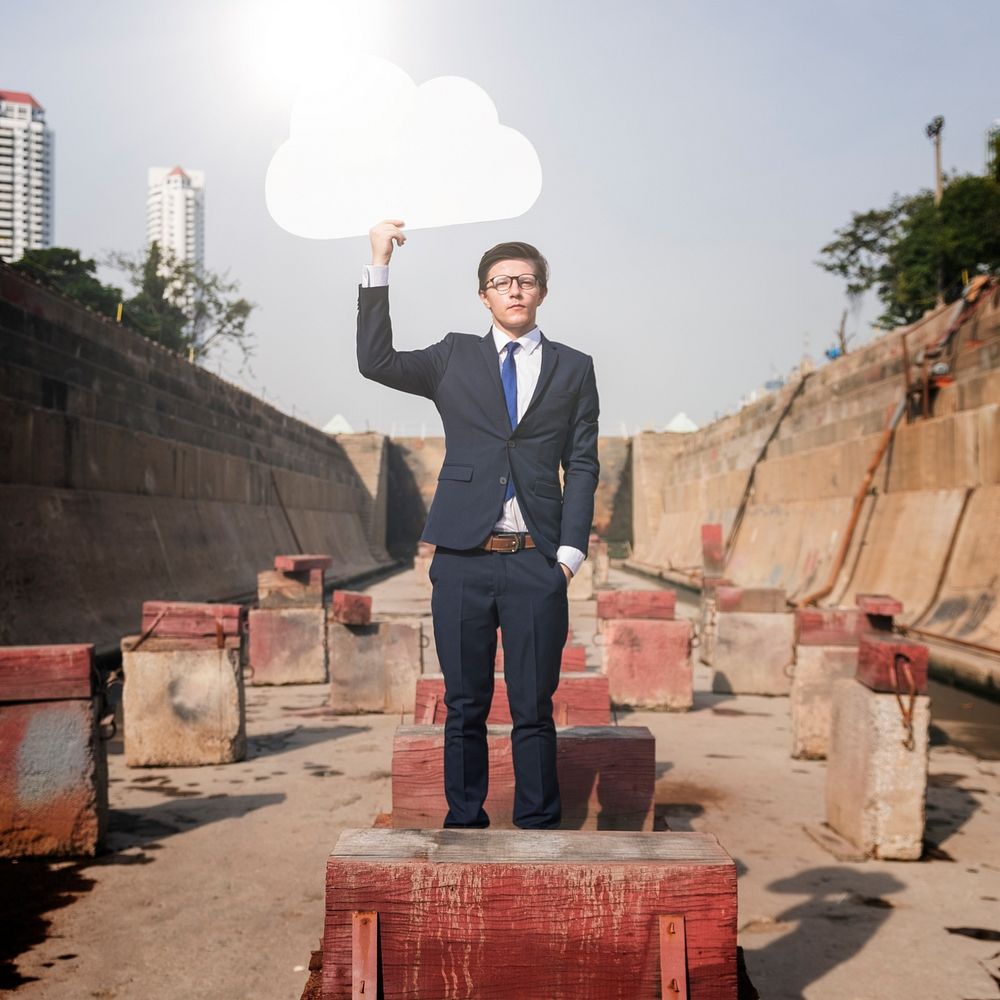 Businessman Holding Cloud Network Symbol Concept