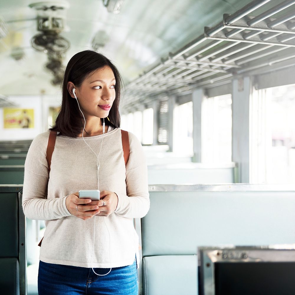 Asian woman riding a train