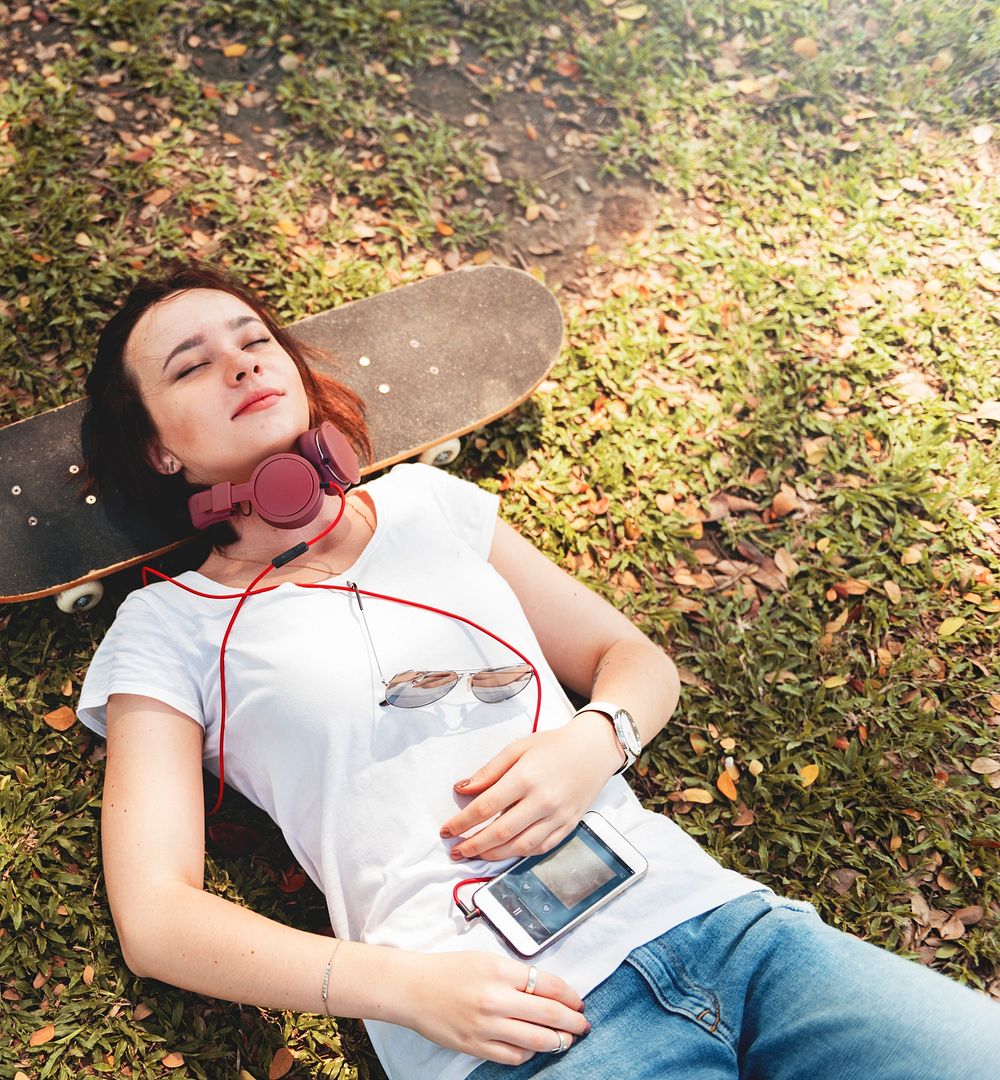 Woman Lying In The Park Relaxation Concept