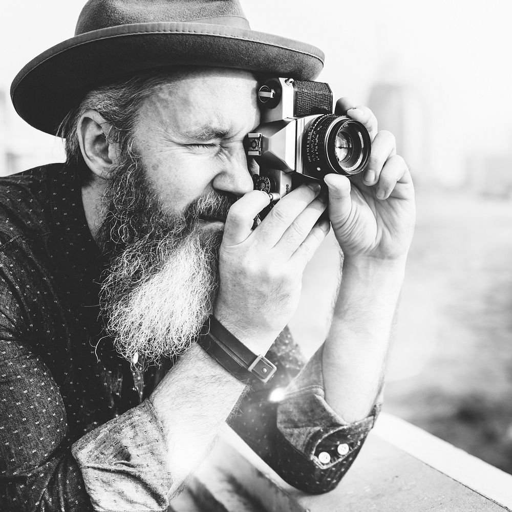 A photographer with an analog camera
