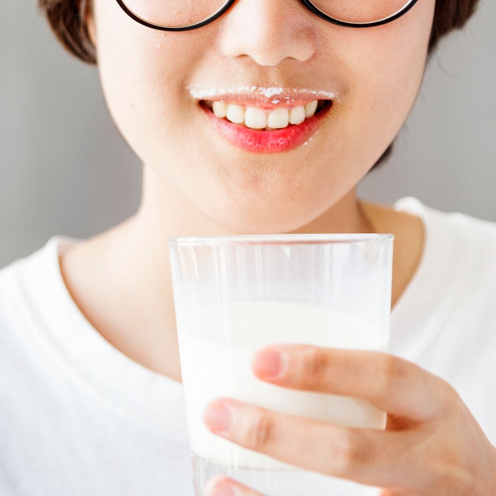 A woman drinking milk