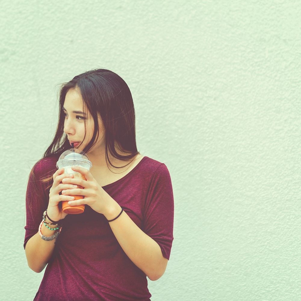 Young woman drinking milk tea