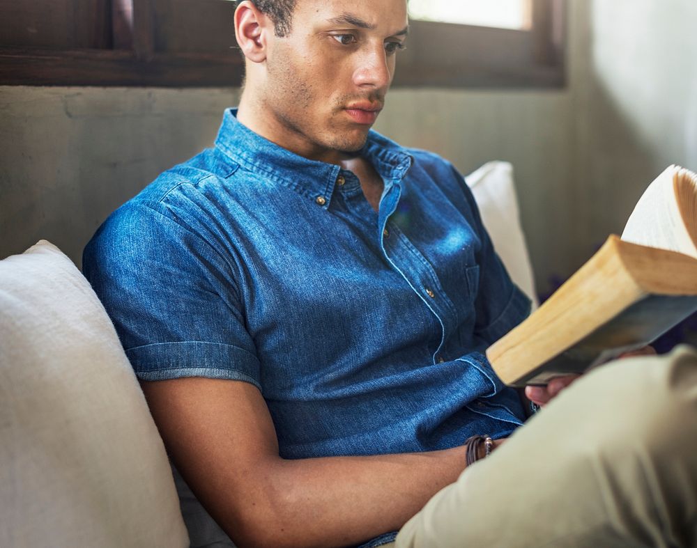 Man relaxing with a book