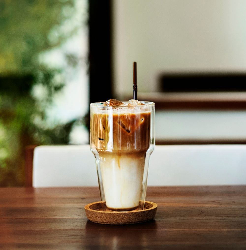 Closeup of cold coffee on wooden table