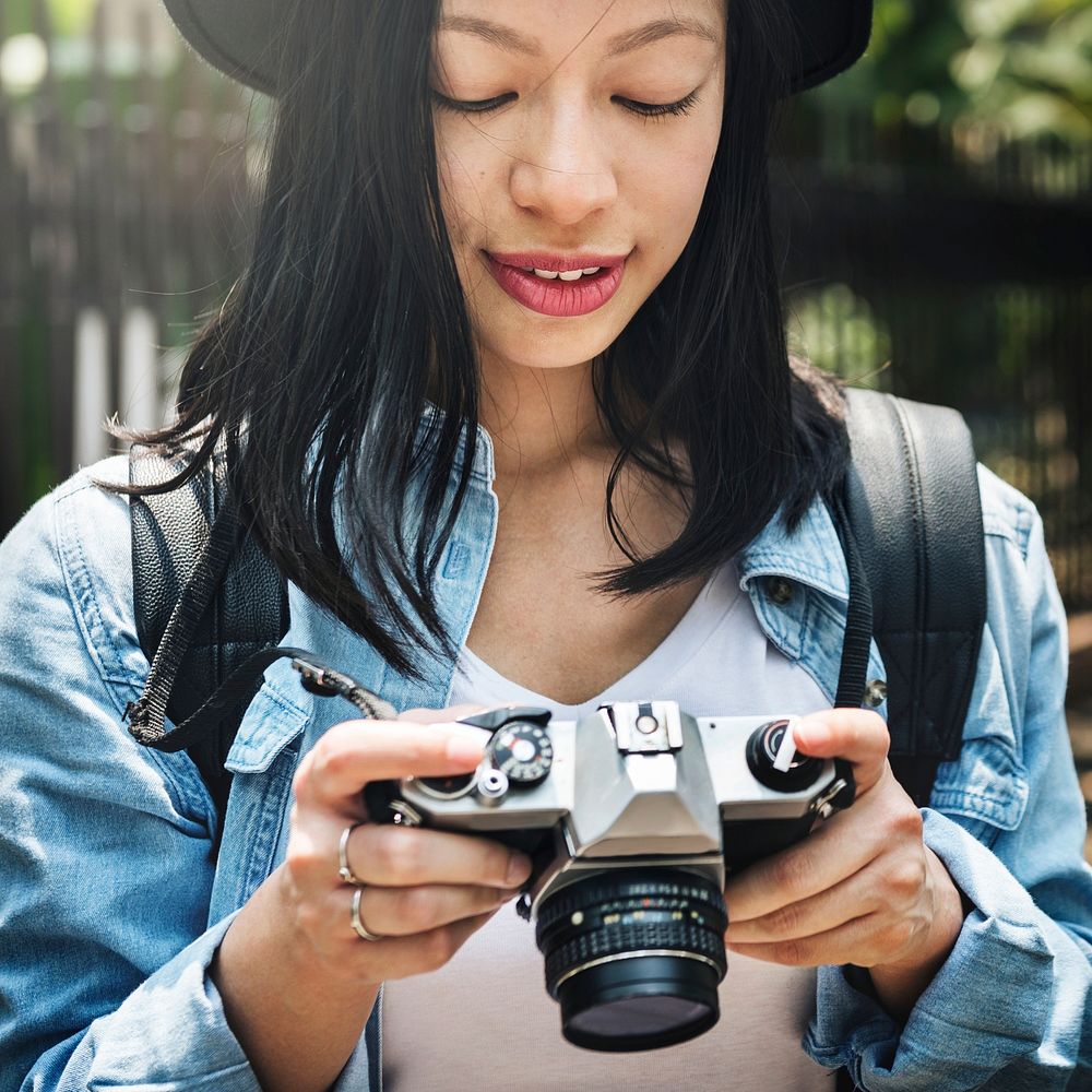 An Asian woman enjoying photographing 