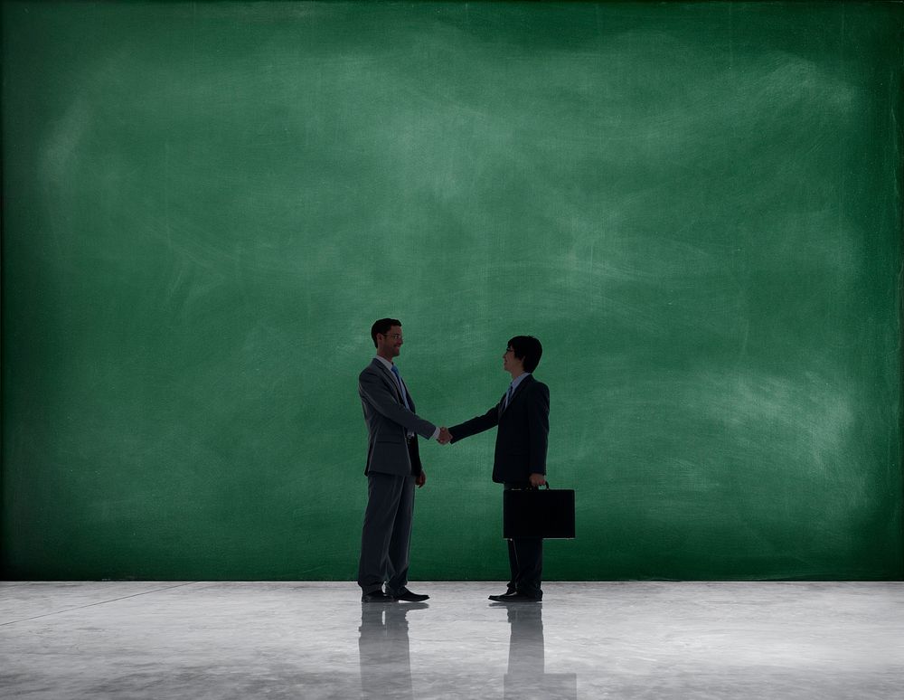 Business Handshake with Green Textured Background