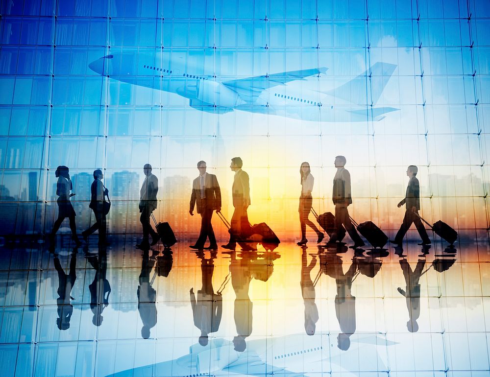 Group of Business Travellers Walking in an Airport