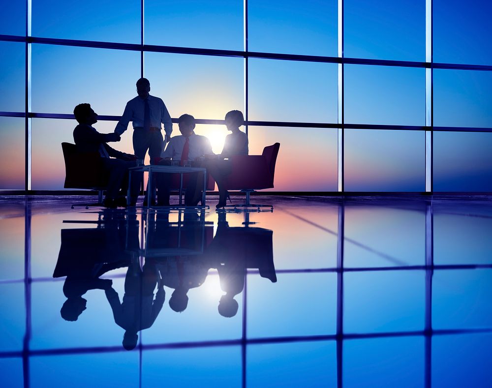 Group of Business People Meeting in Back Lit