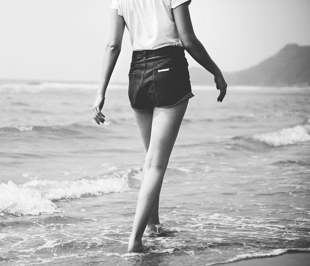 Woman walking along the beach