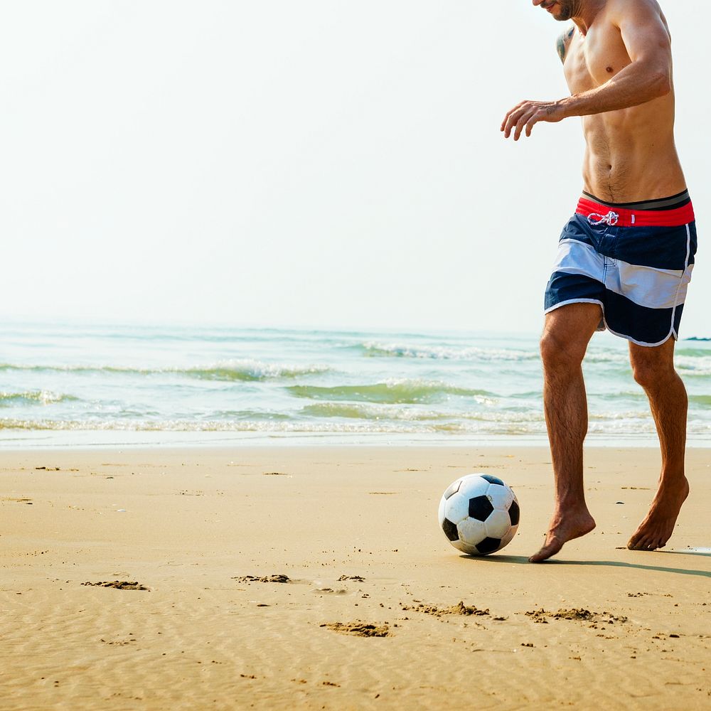 Man Beach Summer Holiday Vacation Football Concept