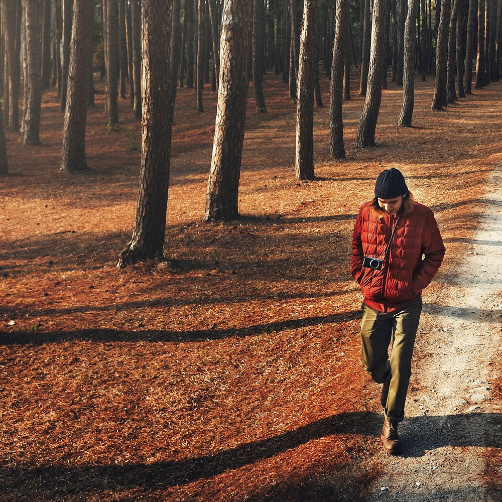 Asian man walking trekking in the wood