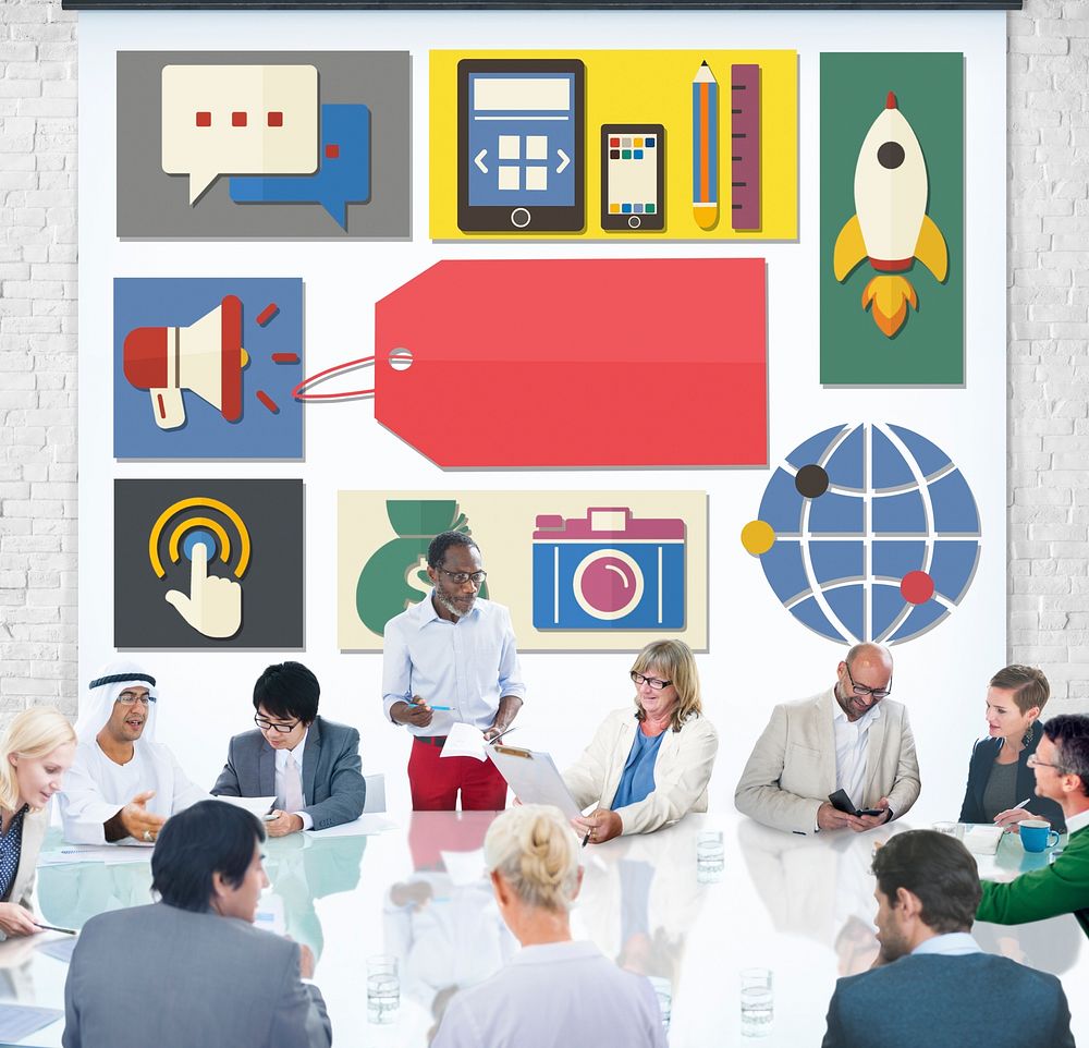 Branding icons on the wall with people at a meeting table