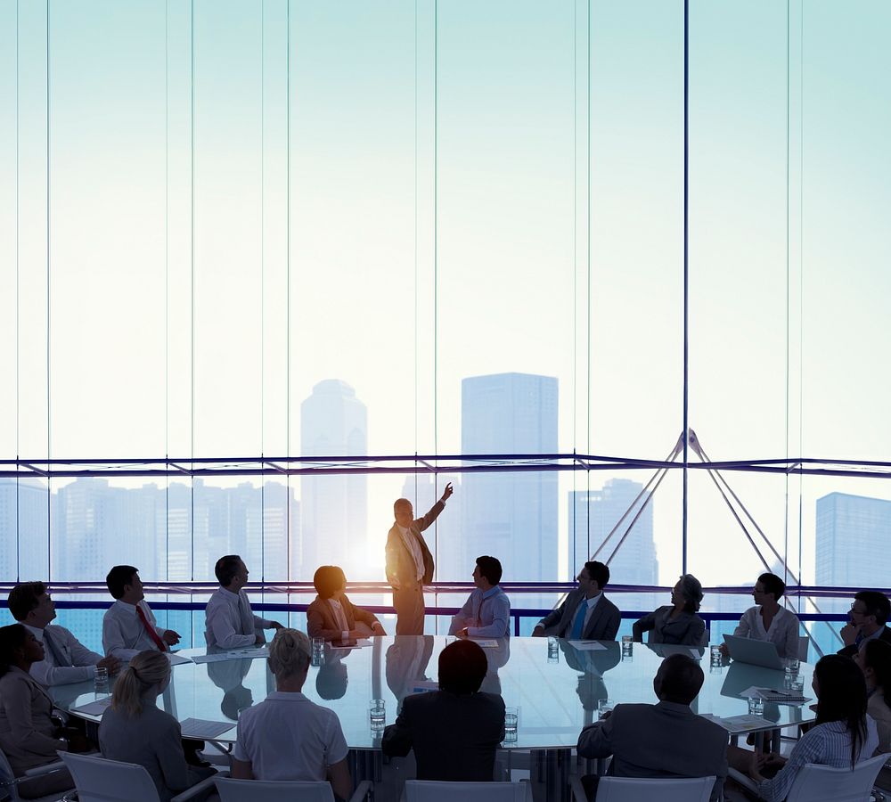 Business people in a meeting room with glass window