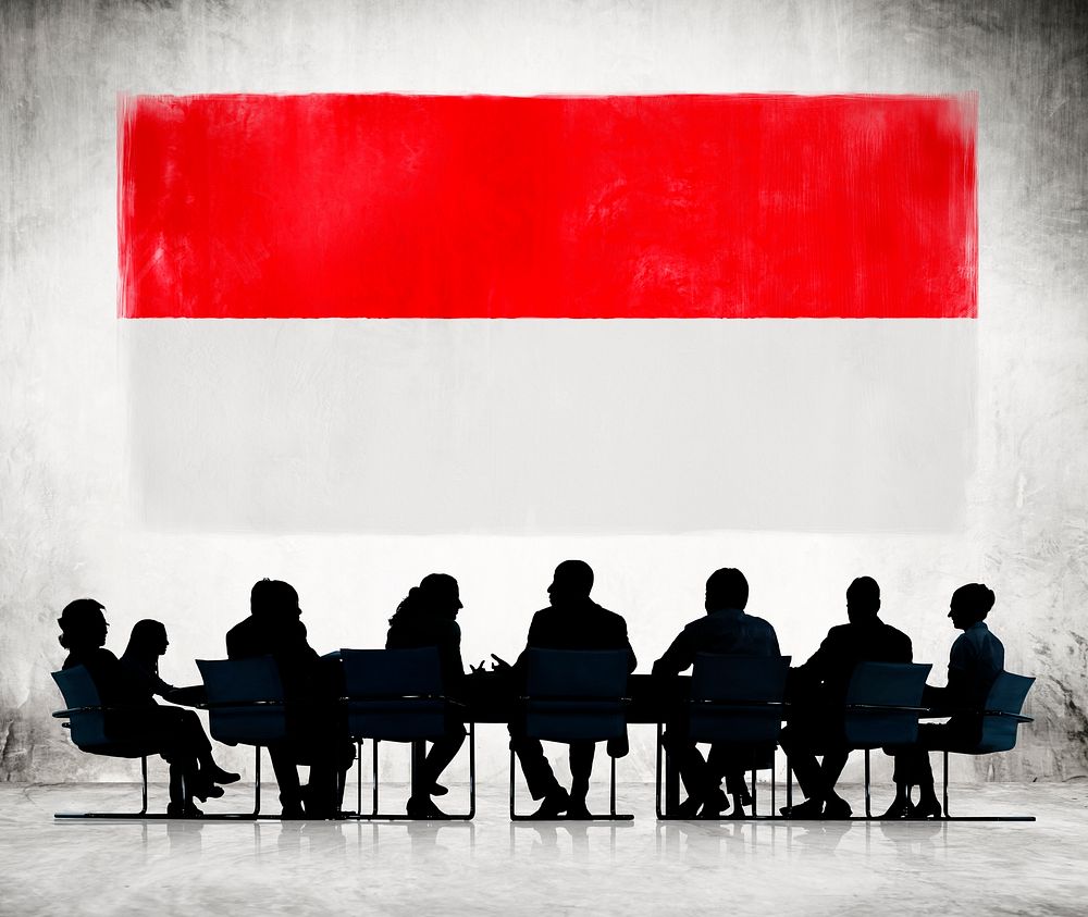 Silhouettes of Business People and a Flag of Indonesia