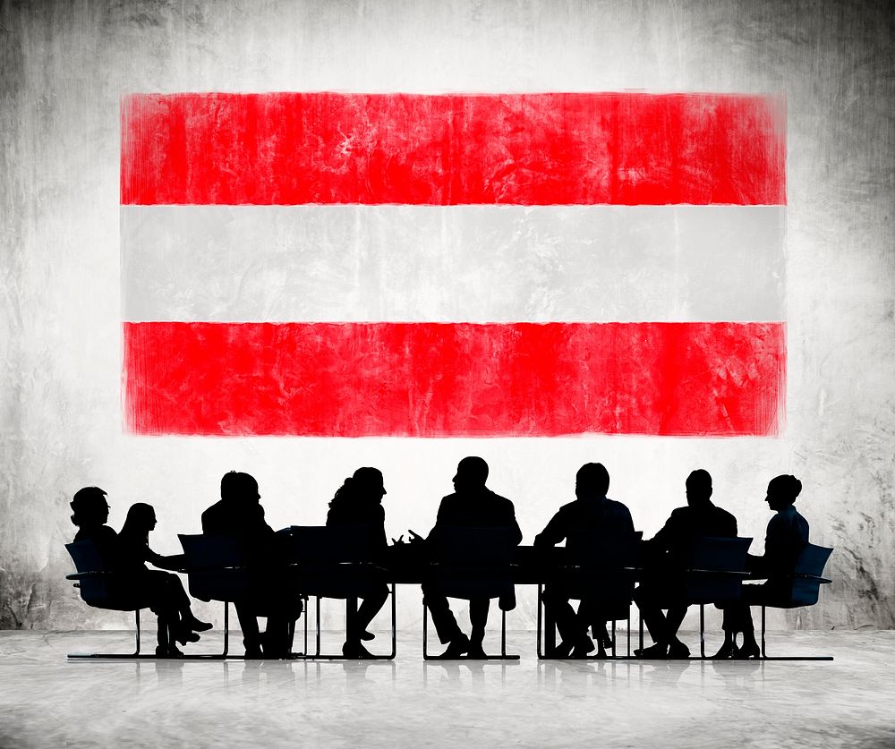 Business People in a Meeting with Austrian Flag