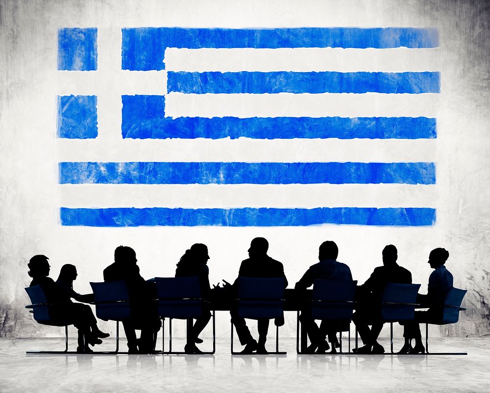 Silhouettes of Business People and a Flag of Greece