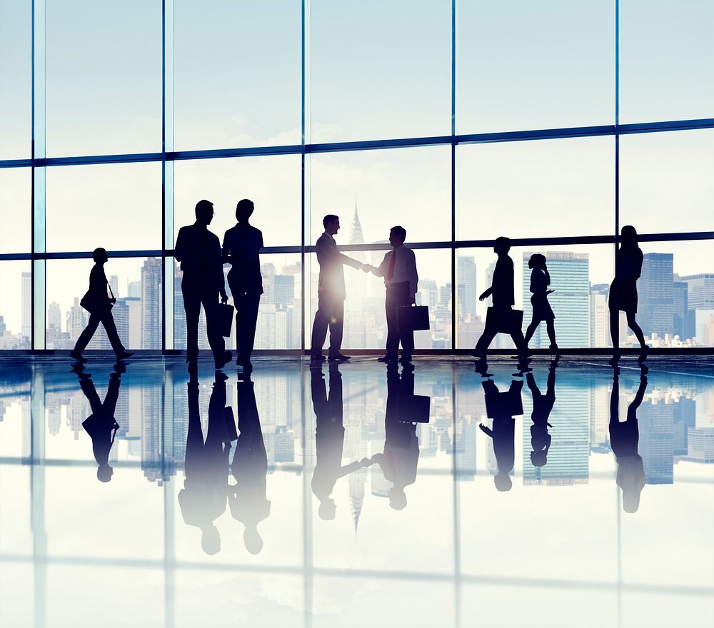 Group of business people standing in a office building.