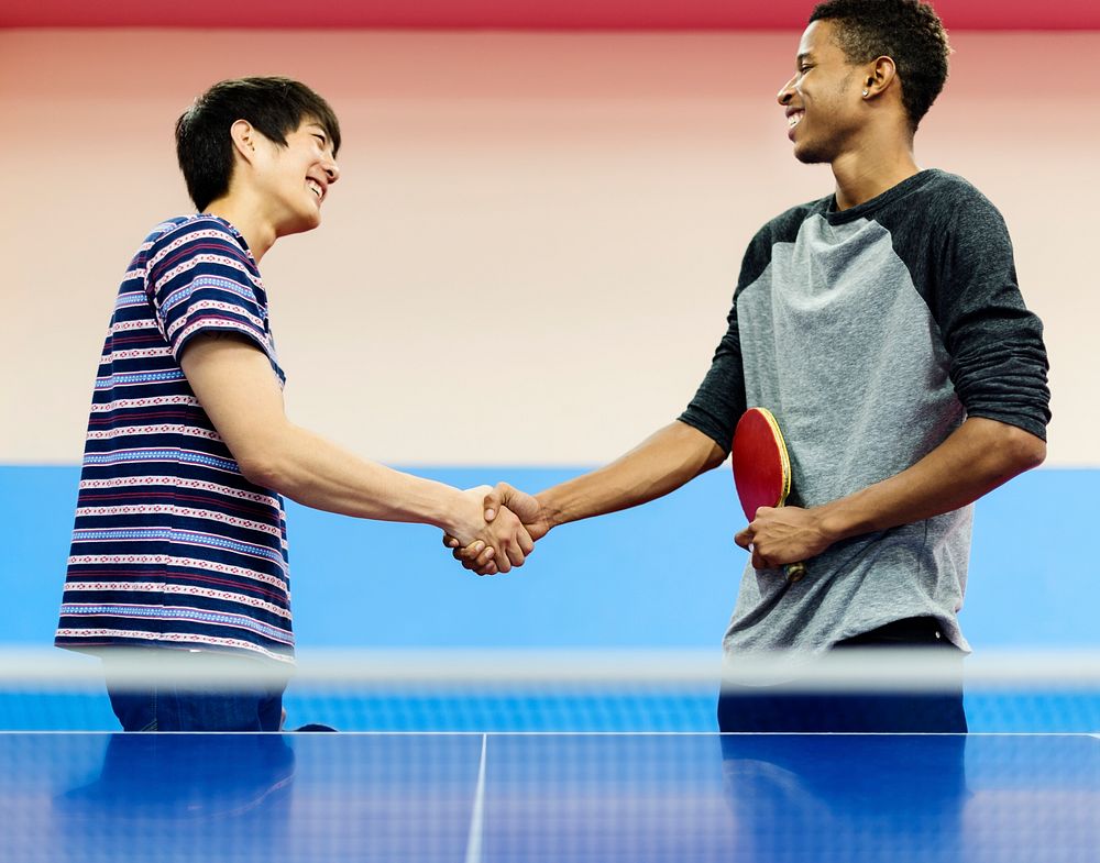 Table tennis players shaking hands